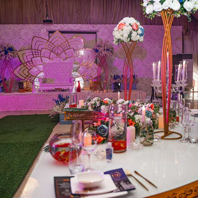 Pink lotus themed wedding reception stage with lush florals — decor by 2A'S Events, Lagos